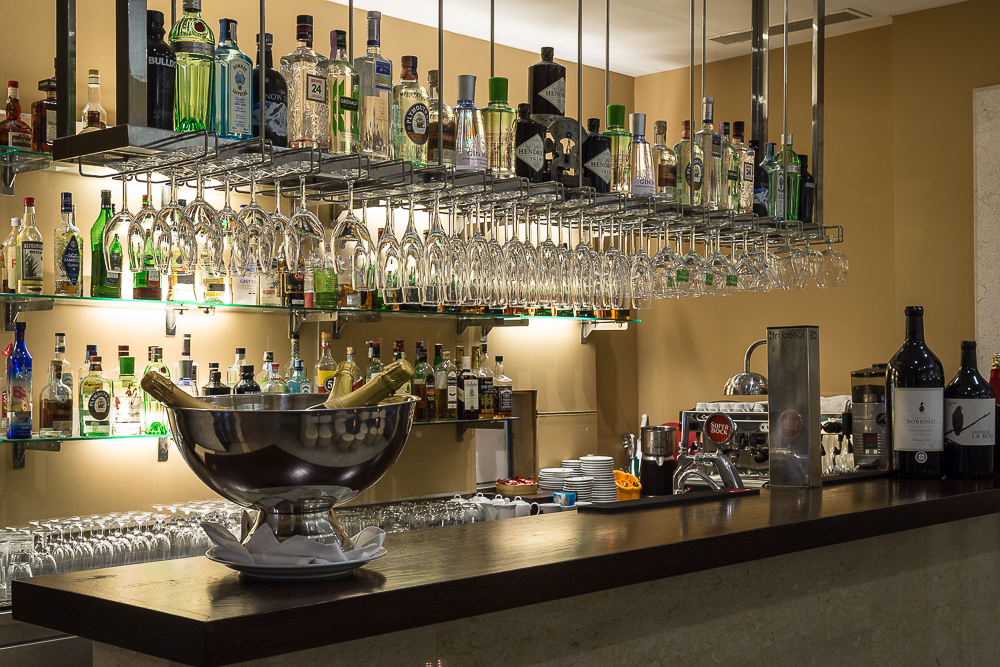 Restaurant bar with glassware and a stocked backbar